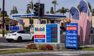 Gas prices are displayed at a Mobile gas station in Huntington Beach