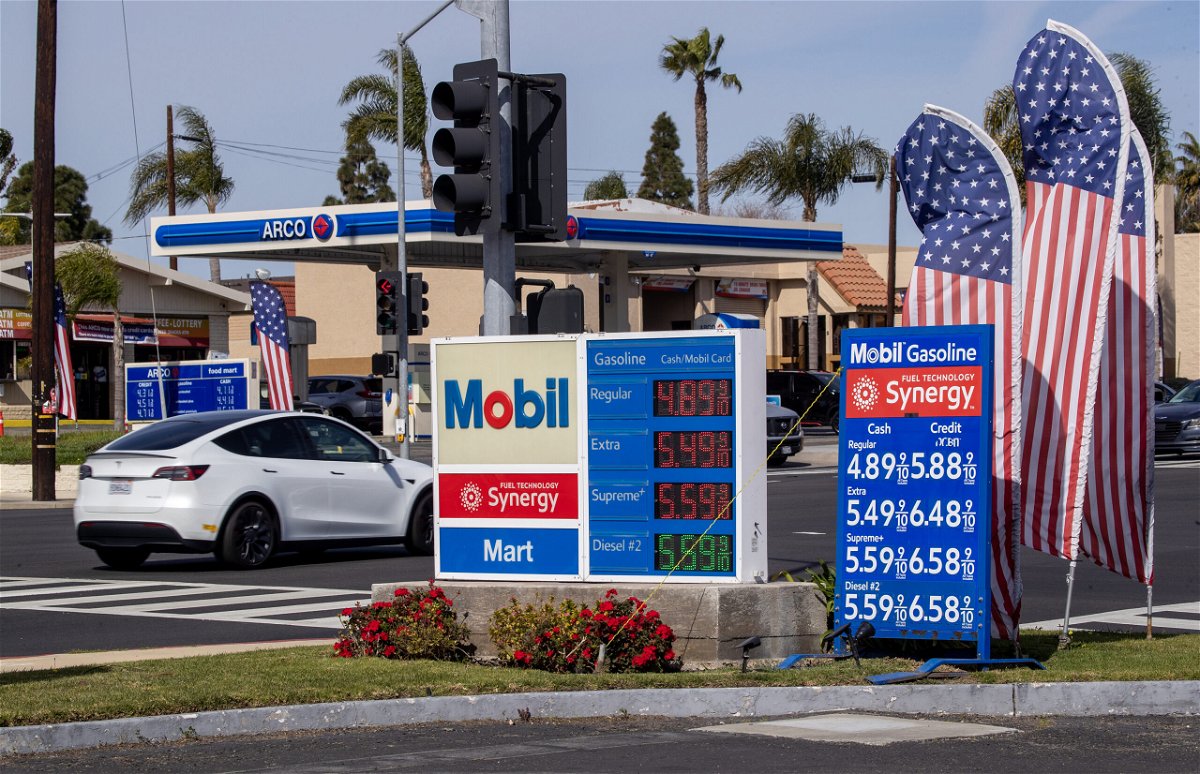 <i>Allen J. Schaben / Los Angeles Times/Getty Images</i><br/>Gas prices are displayed at a Mobile gas station in Huntington Beach