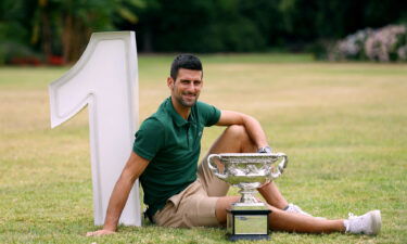 Australian Open champion Novak Djokovic poses with the trophy.