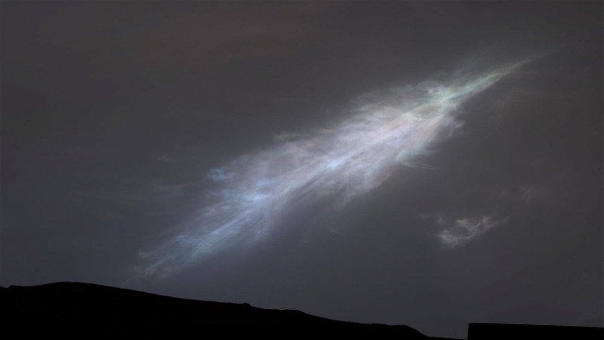 <i>NASA/JPL-Caltech/MSSS</i><br/>The Curiosity rover just sent back a stunning postcard capturing its view of a shimmering sunset on Mars. The rover captured this feather-shaped iridescent cloud just after sunset on January 27.