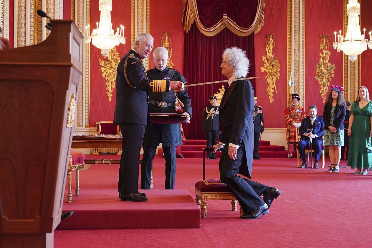 <i>Jonathan Brady/PA/AP</i><br/>Brian May was made a Knight Bachelor by King Charles III at Buckingham Palace on March 14.
