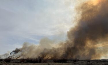 Hundreds of acres of land have been burned by a wildfire sparked in Uintah County that is threatening residents and infrastructure.