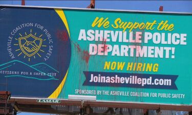 Just days after three billboards backing the police department went up in Asheville