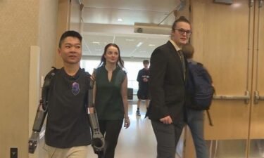 A student at Colorado State University has received a "game-changing" gift from some of his peers after engineering students spent a year building new robotic prosthetic arms.