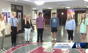 Members of a Central Alabama high school choir are receiving national recognition after an impromptu singing of the National Anthem. Seven members of the Hewitt-Trussville High School choir gathered in the school's front lobby on Tuesday afternoon to perform the National Anthem