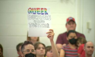 Over 100 people donning red shirts showed up to the Kirkwood School District meeting in protest of how they believe the district handles transgender educators.