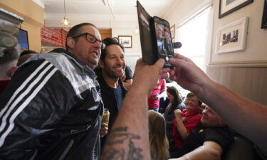 Rudd appears in photographs alongside Wrexham fans in The Turf Pub ahead of Saturday's match.