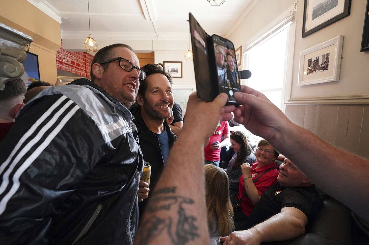 <i>Martin Rickett/AP</i><br/>Rudd appears in photographs alongside Wrexham fans in The Turf Pub ahead of Saturday's match.