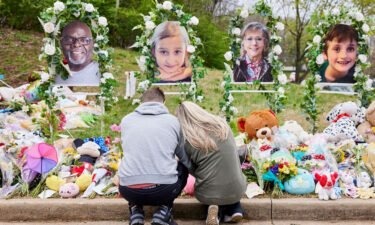A couple prays at the memorial for the victims of the shooting at the Covenant School in Nashville on March 31.