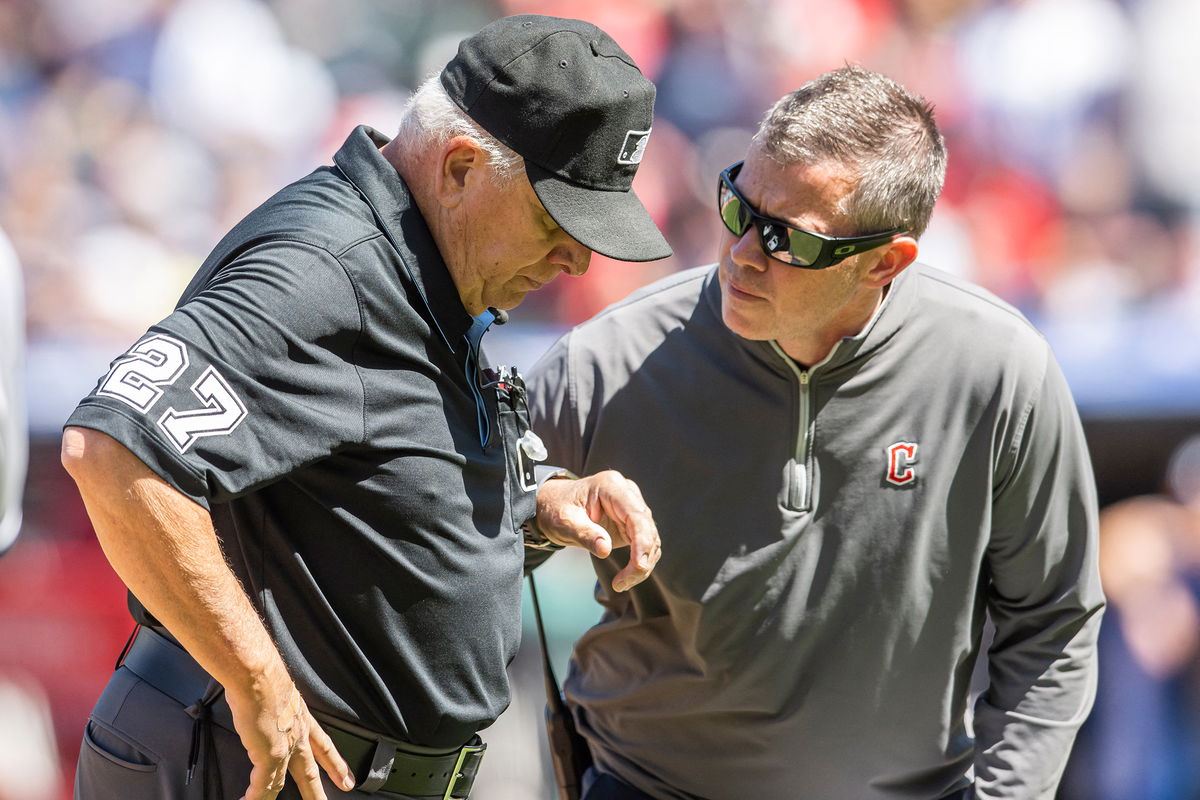 <i>Ken Blaze/USA Today Sports/Reuters</i><br/>Cleveland Guardians trainer James Quinlan (right) looks after Umpire Larry Vanover after Vanover was hit with a baseball during a game between the Guardians and the New York Yankees at Progressive Field in Cleveland on April 12.