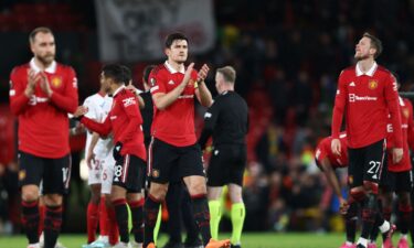 Manchester United concedes two late own goals to leave Europa League tie with Sevilla hanging in the balance. United players applaud the crowd at Old Trafford after throwing away a comfortable two-goal lead late in the match.