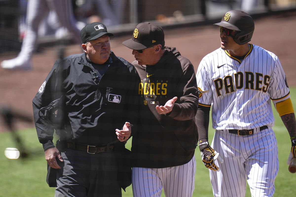 <i>Gregory Bull/AP</i><br/>San Diego Padres manager Bob Melvin (center) talks with an umpire as Machado is being ejected.