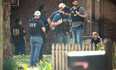 Metro Nashville Police and the FBI search and investigate a house following a mass shooting at Covenant School