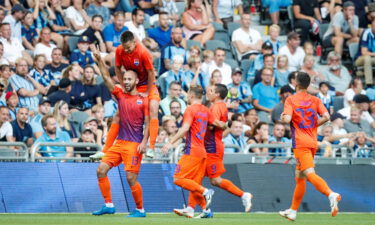 Mariupol's Sergiy Yavorsky celebrates with his teammates.