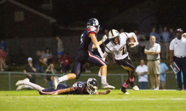 Dadeville's Philstavious Dowdell (7) fends off an opposing player during a football game on October 08