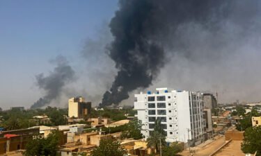 Smoke billows above residential buildings in Khartoum on April 16