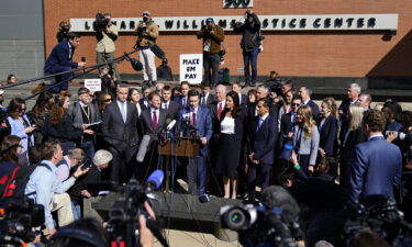 Attorneys for Dominion Voting Systems speak at a news conference outside New Castle County Courthouse in Wilmington