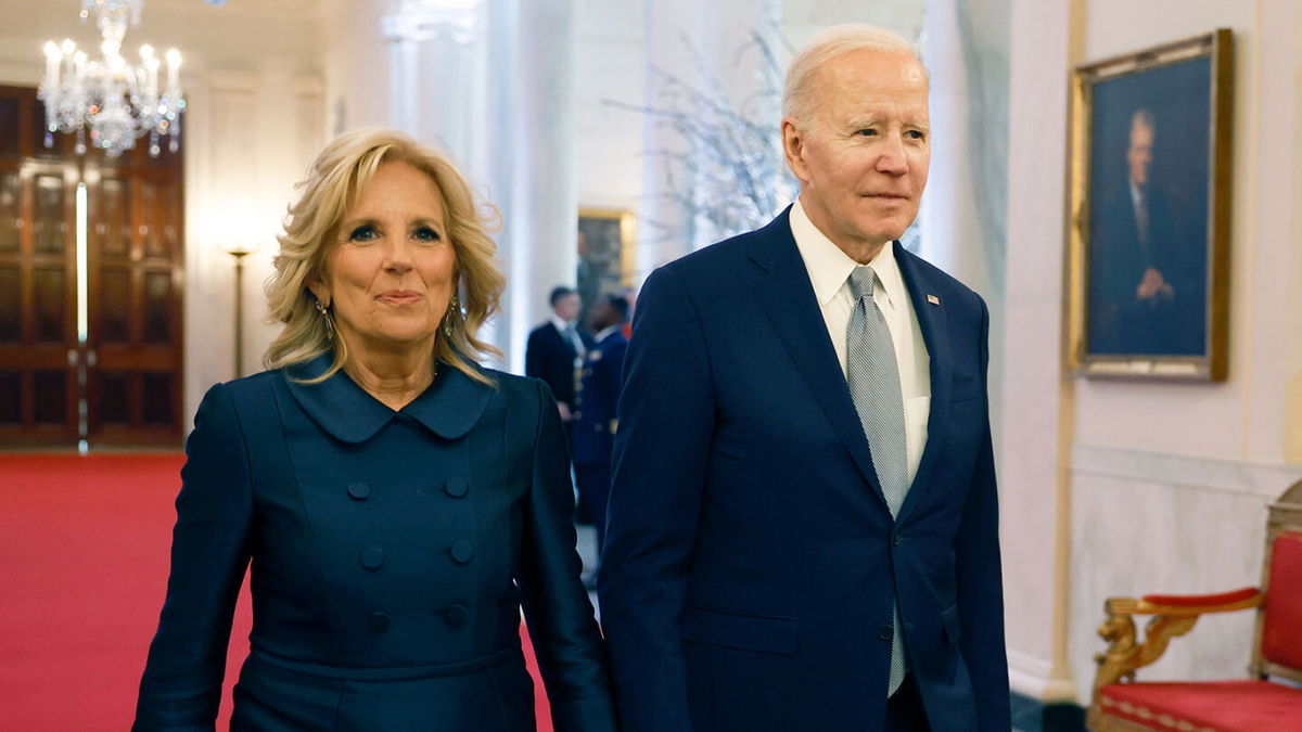 <i>Anna Moneymaker/Getty Images/Getty Images</i><br/>President Joe Biden (right) and first lady Jill Biden arrive for a ceremony honoring the recipients of the 2021 National Humanities Medals and the 2021 National Medals of Arts in the East Room of the White House on March 21.