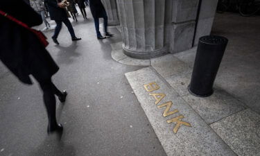 This photograph taken on March 20 shows the sign "Bank" at the entrance of the headquarters of Swiss giant banking UBS in Zurich.