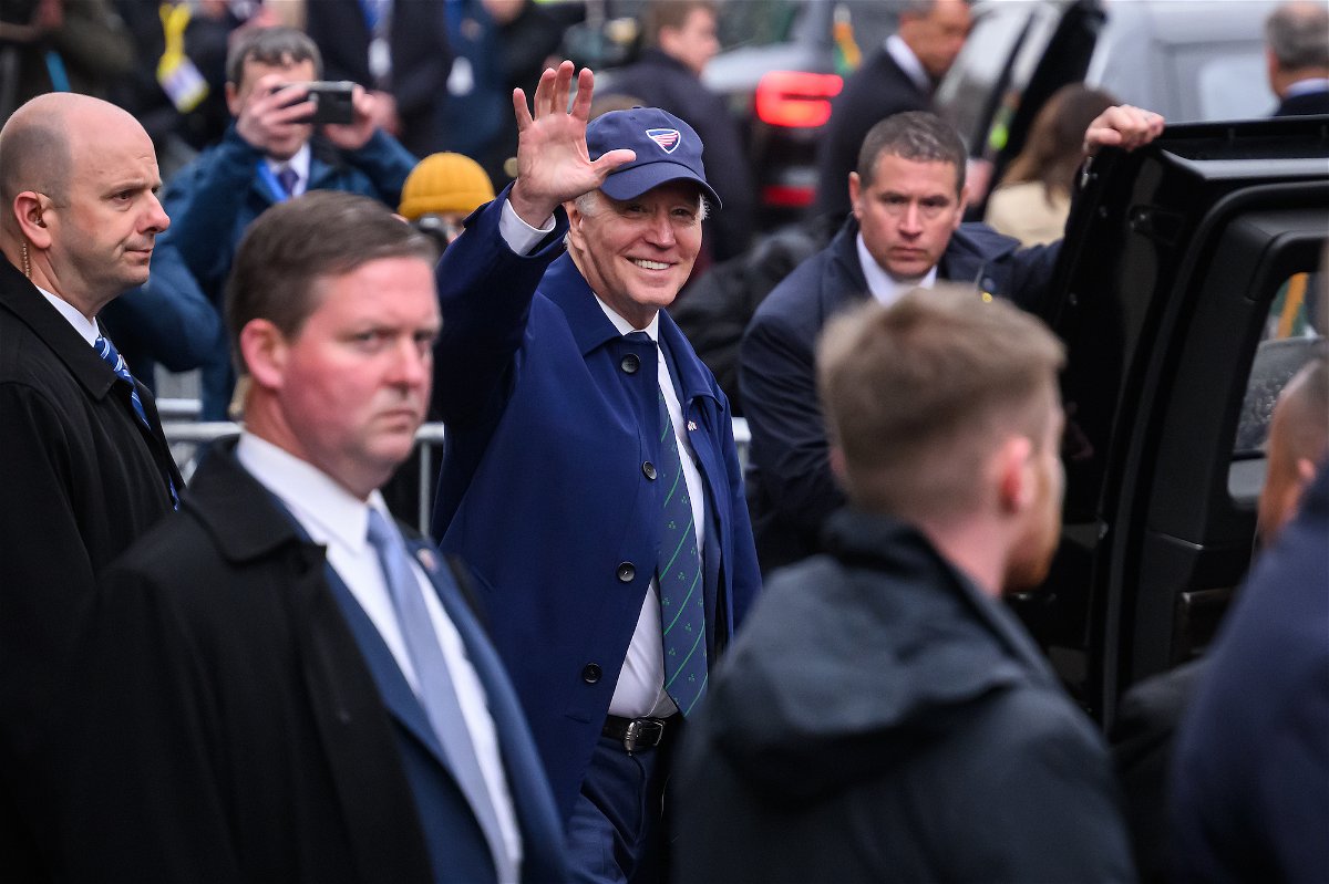 <i>Leon Neal/Getty Images</i><br/>President Joe Biden waves to members of the public who have gathered for his arrival on April 12
