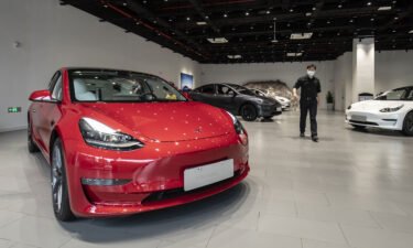Customers at a Tesla Inc. showroom in Shanghai