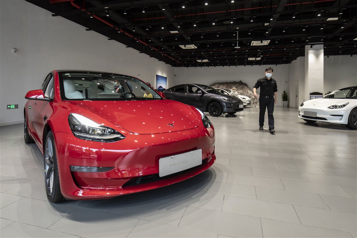 <i>Qilai Shen/Bloomberg/Getty Images</i><br/>Customers at a Tesla Inc. showroom in Shanghai