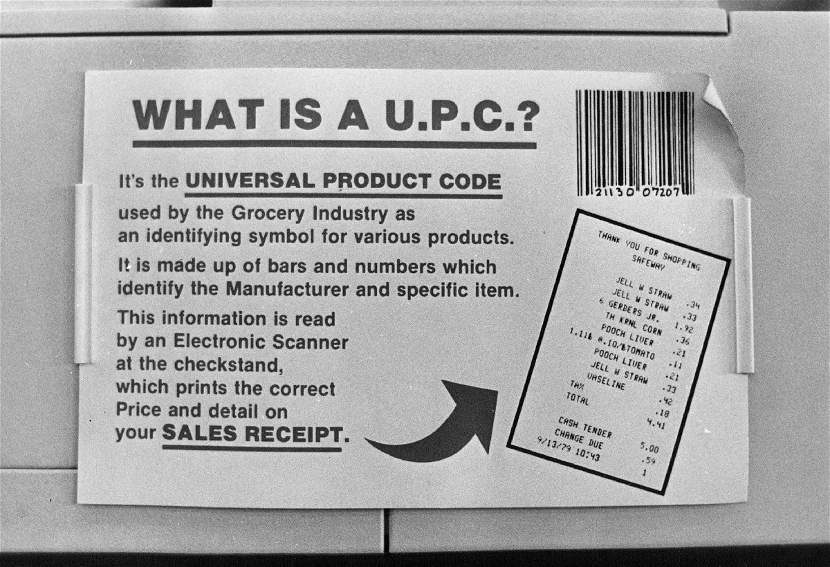 <i>The Denver Post/Getty Images</i><br/>A sign from 1980 introduces the UPC to shoppers at a supermarket checkout in Aurora