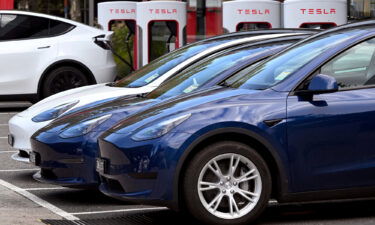 Electric vehicles (EV) line up outside a Tesla dealership in Melbourne