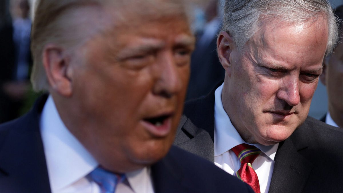 <i>Alex Wong/Getty Images</i><br/>Then-President Donald Trump speaks as White House chief of staff Mark Meadows listens prior to Trump's Marine One departure from the South Lawn of the White House on July 29