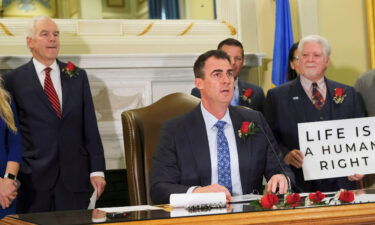 Gov. Kevin Stitt signs Senate Bill 612 on April 12