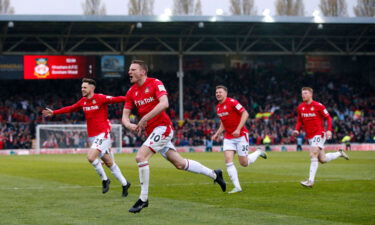 Wrexham's Paul Mullin celebrates scoring its second goal against Boreham Wood.