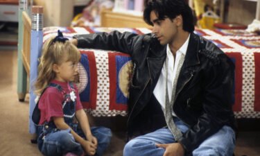 Ashley Olsen and John Stamos in "Full House" in 1992.