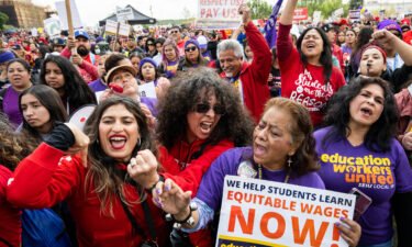 Los Angeles Unified School District teachers join school aids as they strike in downtown Los Angeles on Thursday