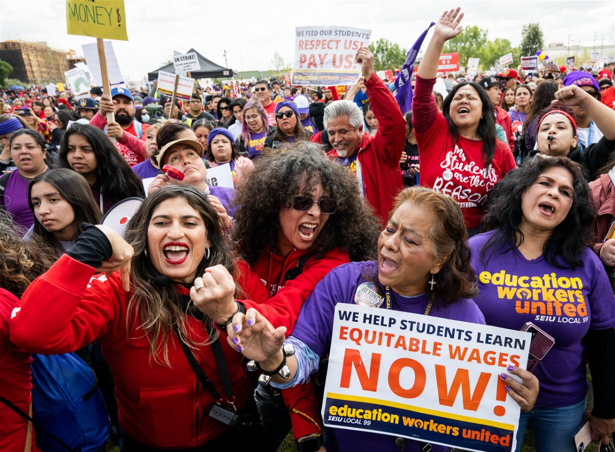 <i>Sarah Reingewirtz/MediaNews Group/Los Angeles Daily News/Getty Images</i><br/>Los Angeles Unified School District teachers join school aids as they strike in downtown Los Angeles on Thursday