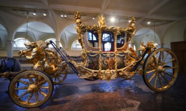 The Gold State Coach on display at the Royal Mews in Buckingham Palace