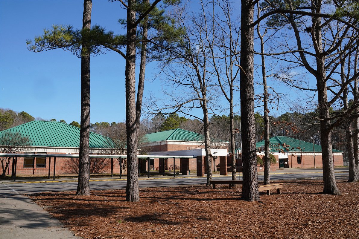 <i>Jay Paul/Getty Images</i><br/>Tall pine trees outside Richneck Elementary School on January 7