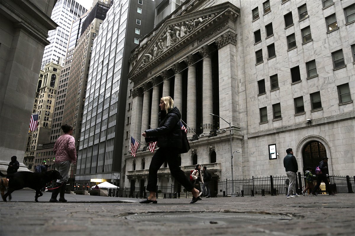 <i>Peter Morgan/AP</i><br/>People pass the front of the New York Stock Exchange in New York