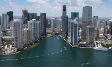 An aerial view of the City of Miami skyline is seen next to the waters of Biscayne Bay on July 21