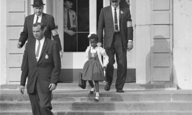 Deputy Marshals escort 6-year-old Ruby Bridges from William Frantz Elementary School in New Orleans