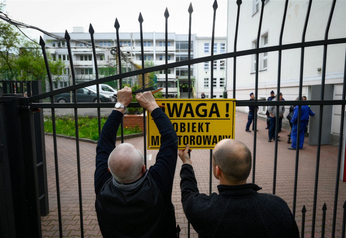 <i>Jaap Arriens/AFP/Getty Images</i><br/>City officials put up a warning sign on the gate of a Russian embassy in Warsaw