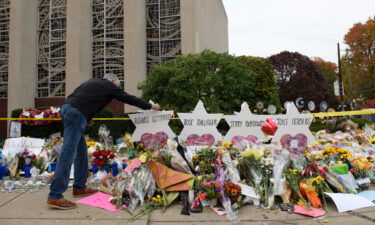 Mourners visit a memorial outside the Tree of Life synagogue on October 31