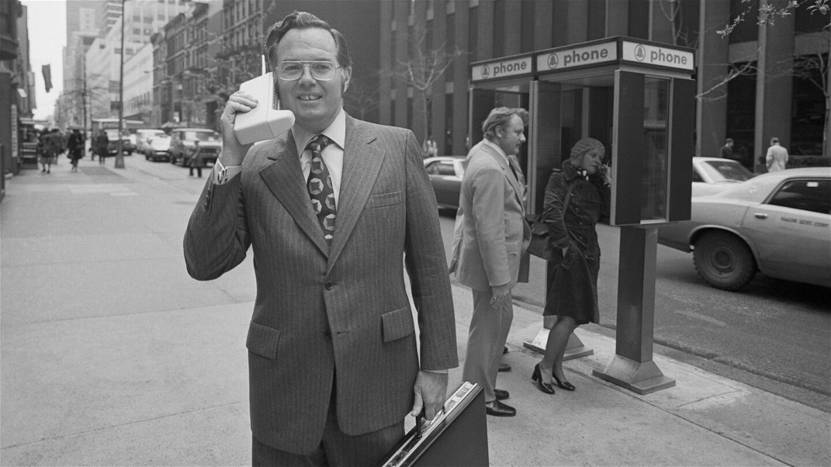 <i>Bettmann/Getty Images</i><br/>Motorola vice president John F. Mitchell shows how easily company's newest product-Dyna T-A-C Portable Radio Telephone System can be used in New York