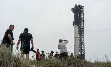Spectators gathers to watch the SpaceX Starship on its Boca Chica launchpad after the U.S. Federal Aviation Administration granted a long-awaited license allowing Elon Musk's SpaceX to launch the rocket to orbit for the first time