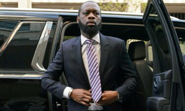 Grammy award-winning Fugees rapper Pras Michel arrives for opening arguments in his trial at US District Court in Washington