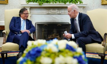 President Joe Biden (right) leans over to speak with Colombian President Gustavo Petro on April 20.