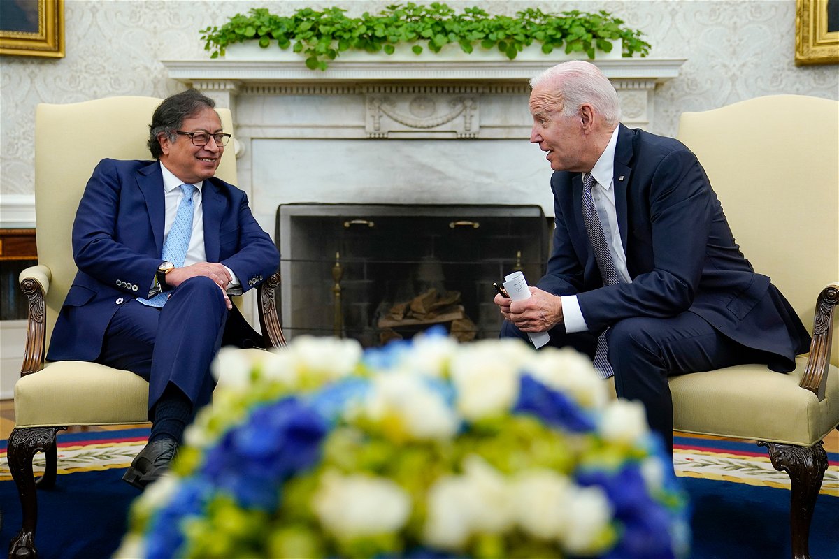 <i>Susan Walsh/AP</i><br/>President Joe Biden (right) leans over to speak with Colombian President Gustavo Petro on April 20.