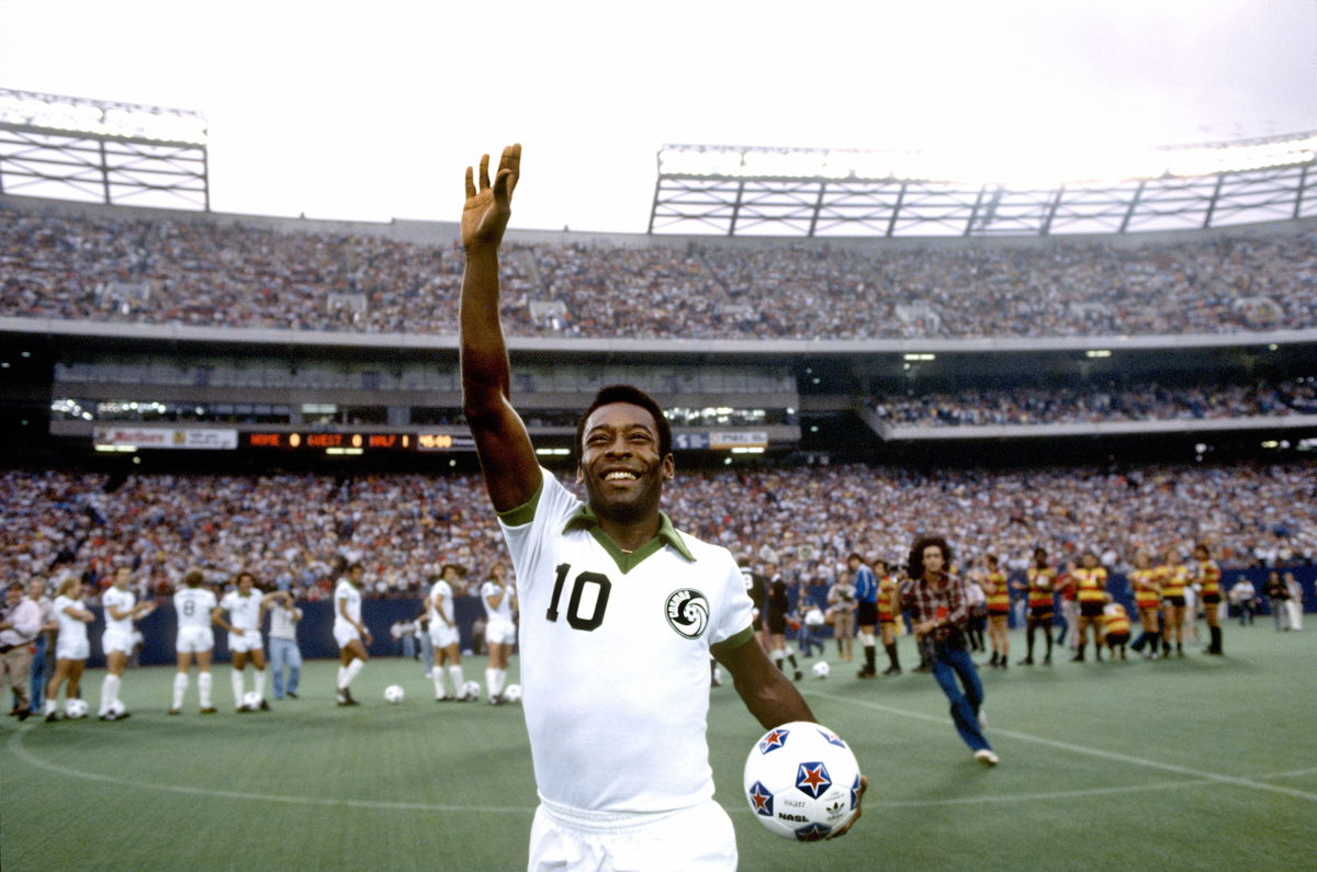 <i>George Tiedemann/Sports Illustrated/Getty Images</i><br/>Pelé celebrates during a match for the New York Cosmos in August 1977.