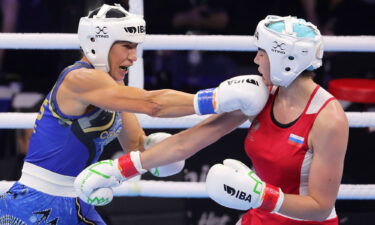 Russia's Anastasiia Demurchian (right) faces Australia's Kaye Scott at the World Women's Boxing Championships in New Delhi