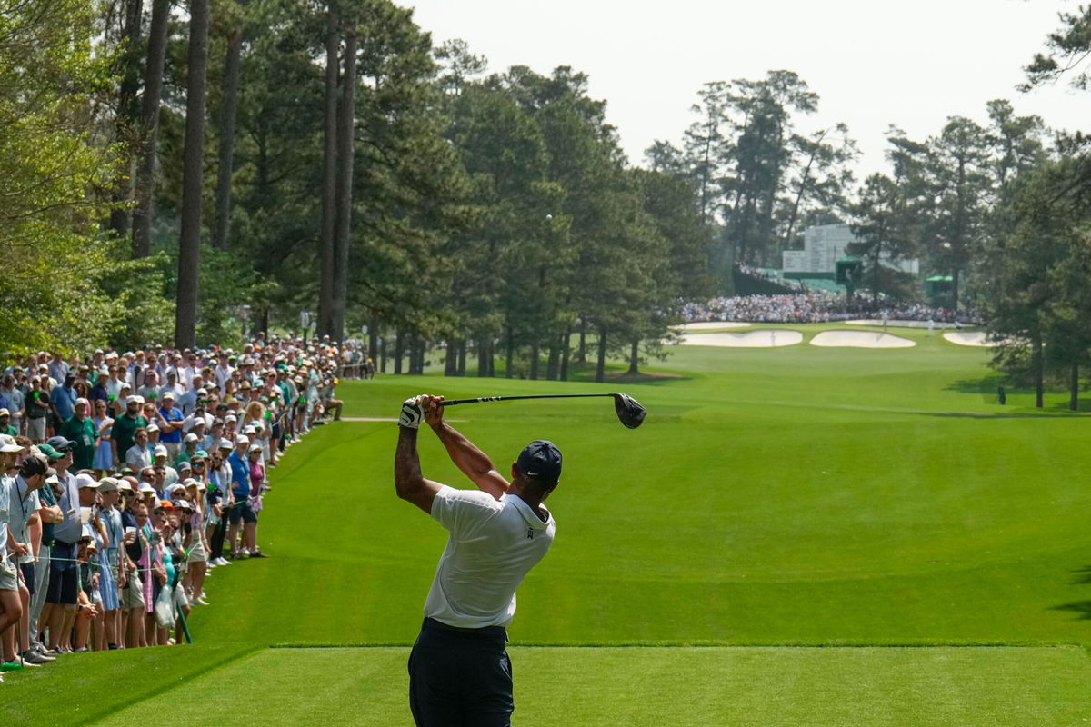 <i>Charlie Riedel/AP</i><br/>Woods tees off during the first round.