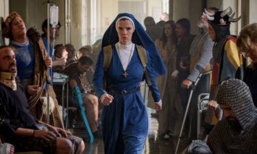 Betty Gilpin is seen here as Simone in "Mrs. Davis."